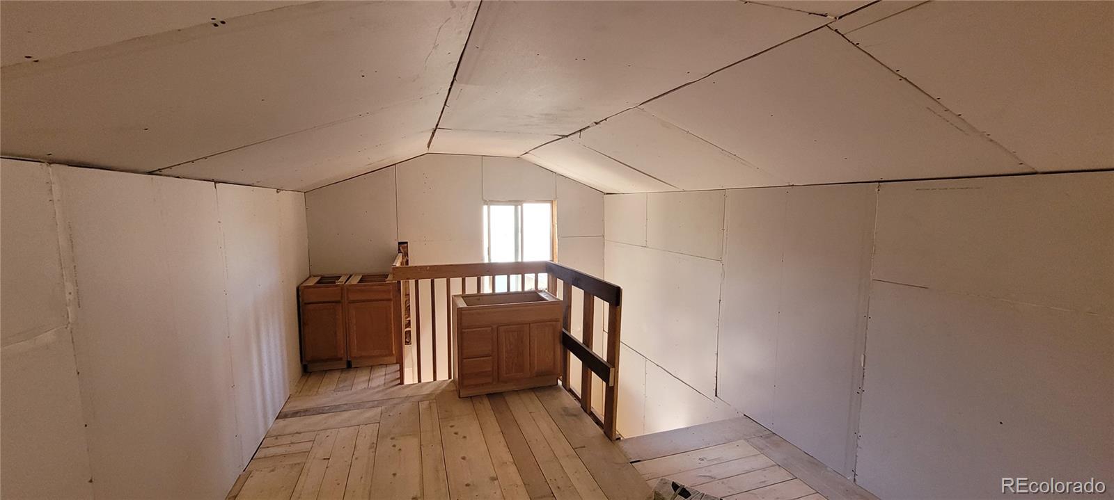 34200 Sioux Trail Pine, CO 80470 - Photo 25 of 37 a view of entryway with wooden floor