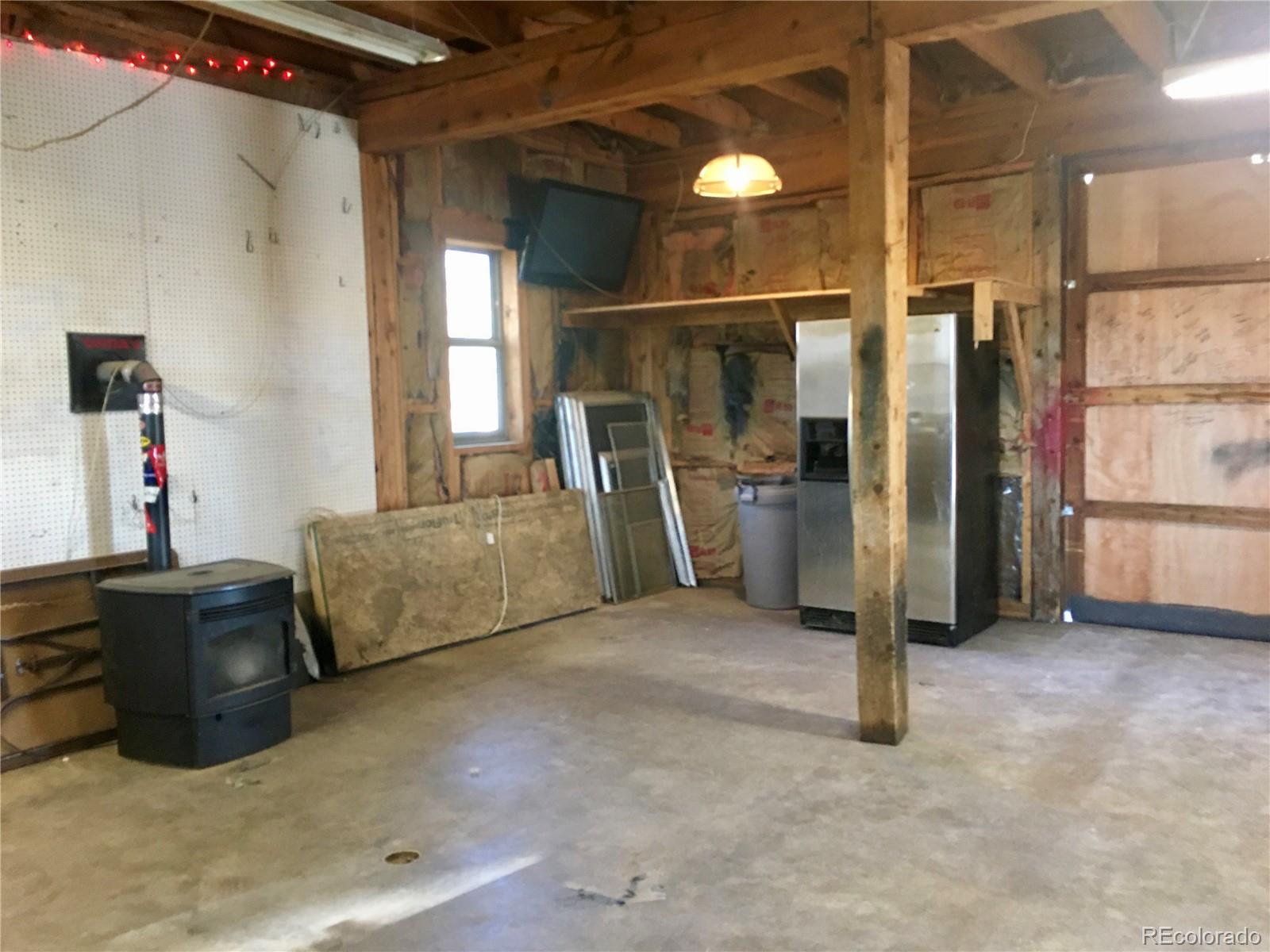 34200 Sioux Trail Pine, CO 80470 - Photo 36 of 37 a view of a livingroom with furniture and a flat screen tv