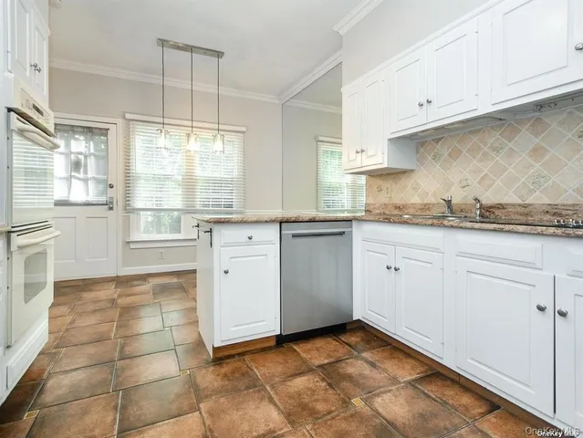 a kitchen with a stove a sink and a refrigerator
