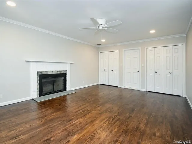 a bathroom with a bathtub a double vanity sink and mirror