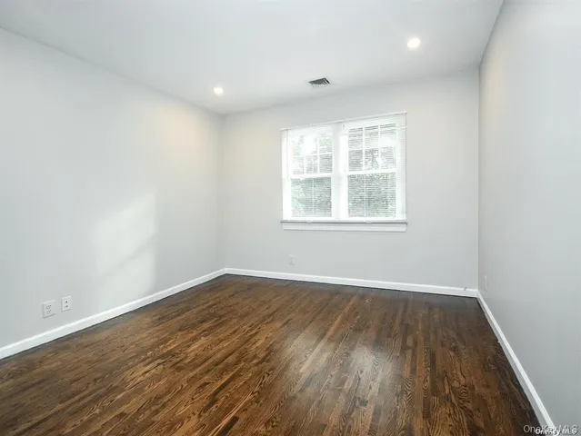 a view of wooden floor in an empty room