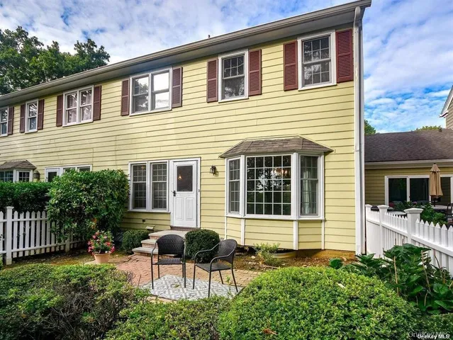 a backyard of a house with seating space