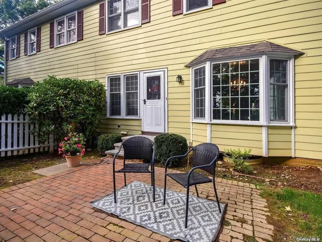a view of a park with trees in the background