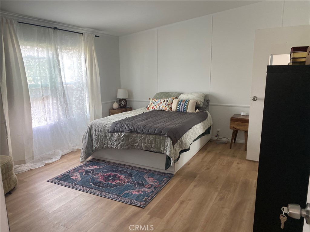 1970 Quintana Road Morro Bay, CA 93442 - Photo 19 of 38 a living room with a bed and a window