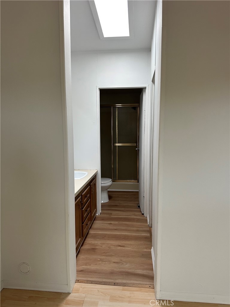 1970 Quintana Road Morro Bay, CA 93442 - Photo 38 of 38 a hallway with wooden floor and staircase