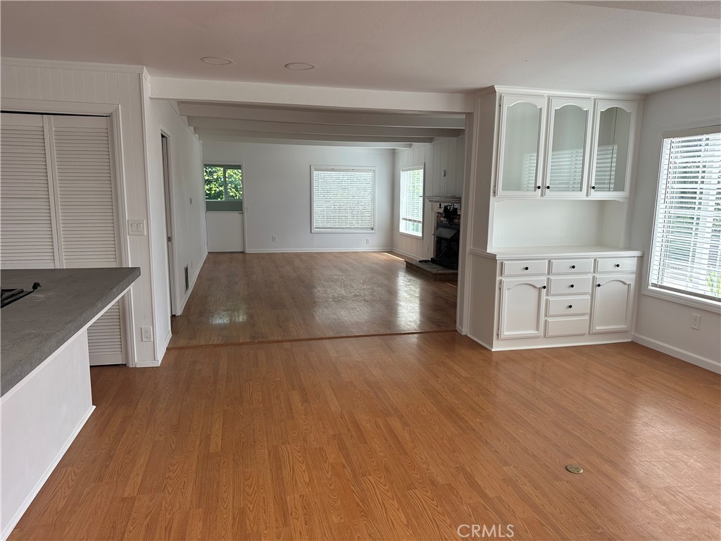 1970 Quintana Road Morro Bay, CA 93442 - Photo 4 of 38 an empty room with wooden floor and windows