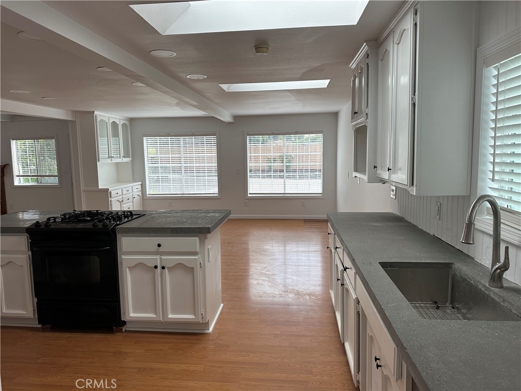 1970 Quintana Road Morro Bay, CA 93442 - Photo 5 of 38 a kitchen with a stove and a sink