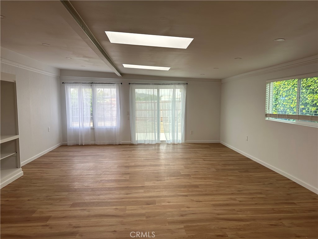 1970 Quintana Road Morro Bay, CA 93442 - Photo 8 of 38 an empty room with wooden floor and windows