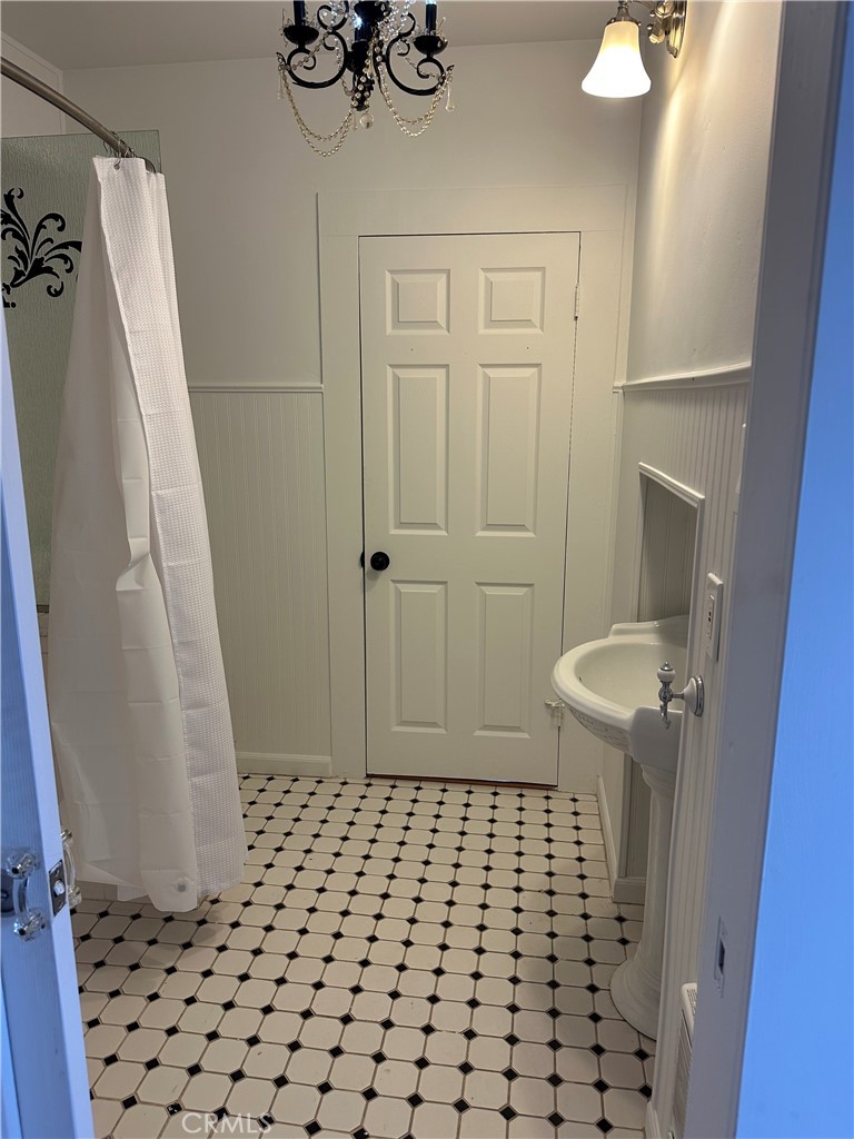 1970 Quintana Road Morro Bay, CA 93442 - Photo 10 of 38 a bathroom with a sink a toilet and a shower