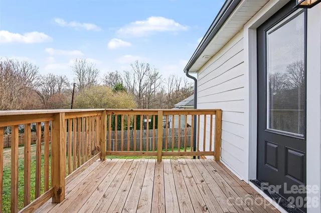 a view of wooden balcony with wooden floor