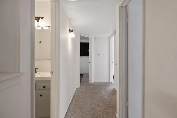 an aerial view of a swimming pool with outdoor seating