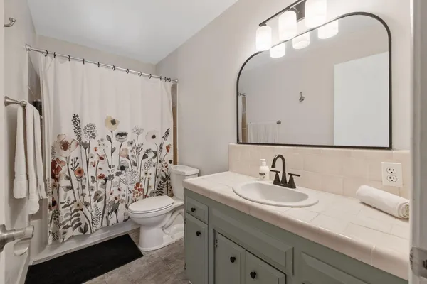 an aerial view of a house with a swimming pool