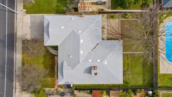 a view of a house with a small yard and plants