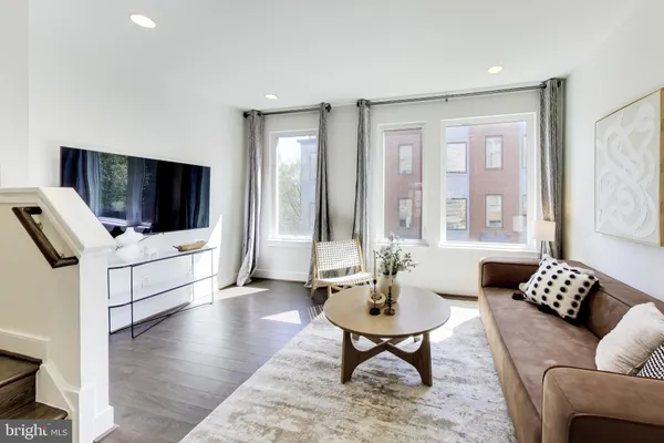 a living room with furniture and a rug