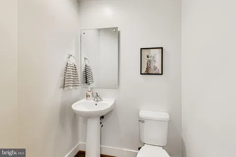 a view of a balcony with wooden floor and fence