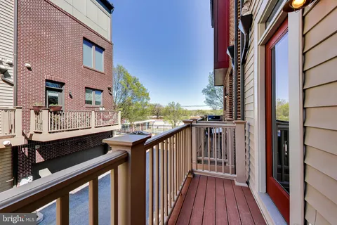 a bedroom with bed and a large window