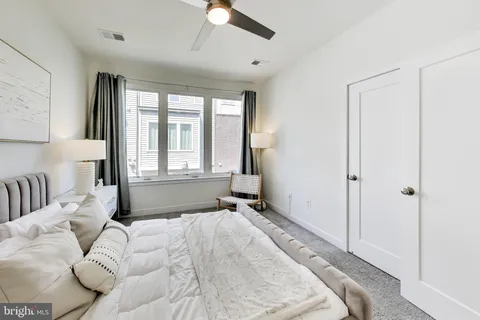 a bedroom with a bed and bathroom