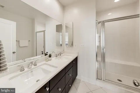 a view of a bathroom with a tub and shower
