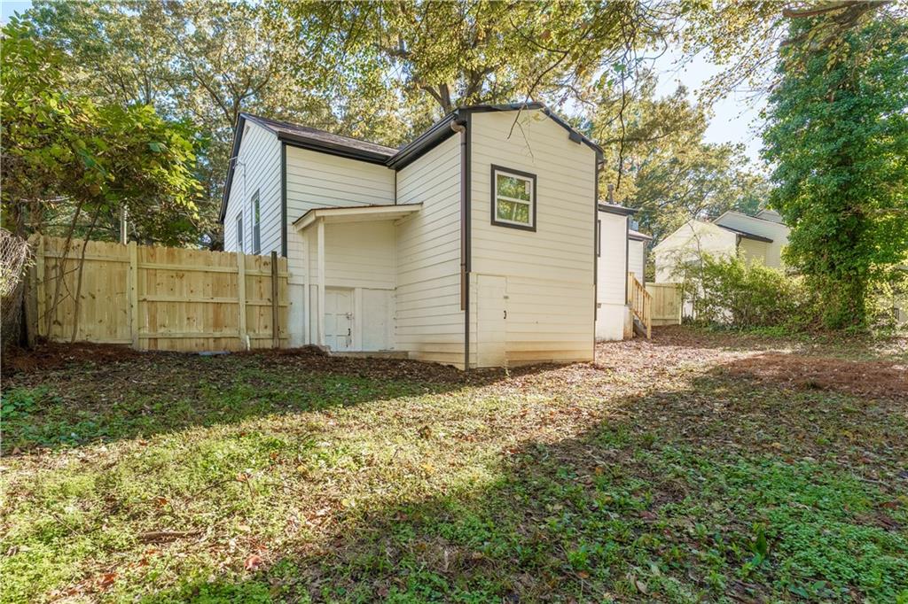 1365 Campbellton Road Southwest Atlanta, GA 30310 - Photo 32 of 36 a view of a house with a backyard