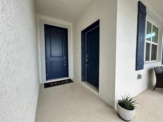 a view of an entryway and kitchen