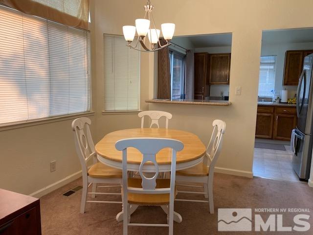 1316 Valley Creek Road Reno, NV 89523 - Photo 3 of 12 a view of a dining room with furniture and wooden floor