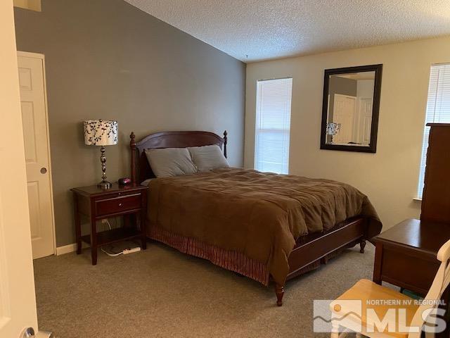 1316 Valley Creek Road Reno, NV 89523 - Photo 5 of 12 a bedroom with a bed and a lamp with window