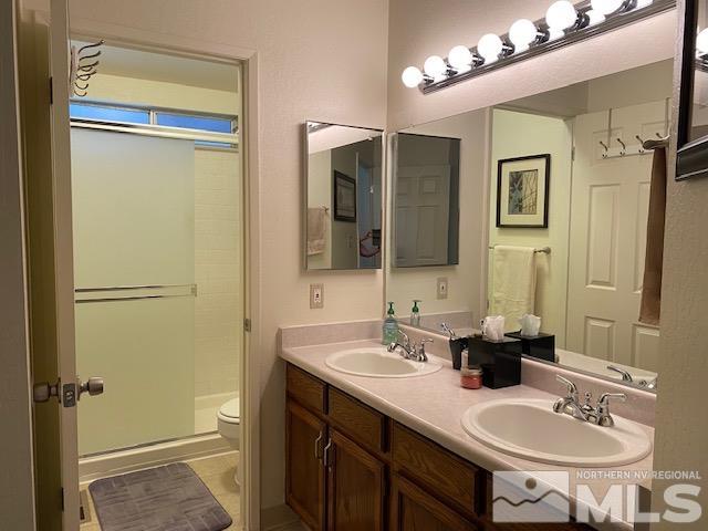 1316 Valley Creek Road Reno, NV 89523 - Photo 6 of 12 a bathroom with a sink and a mirror
