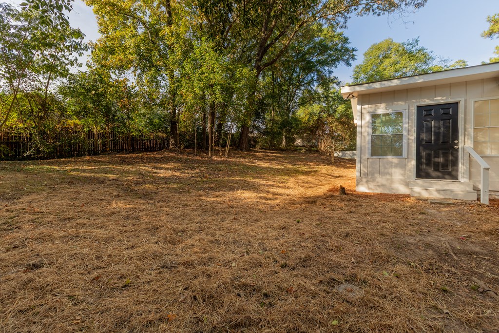 4813 Rowland Court Columbus, GA 31907 - Photo 15 of 16 a view of a house with a yard and garage