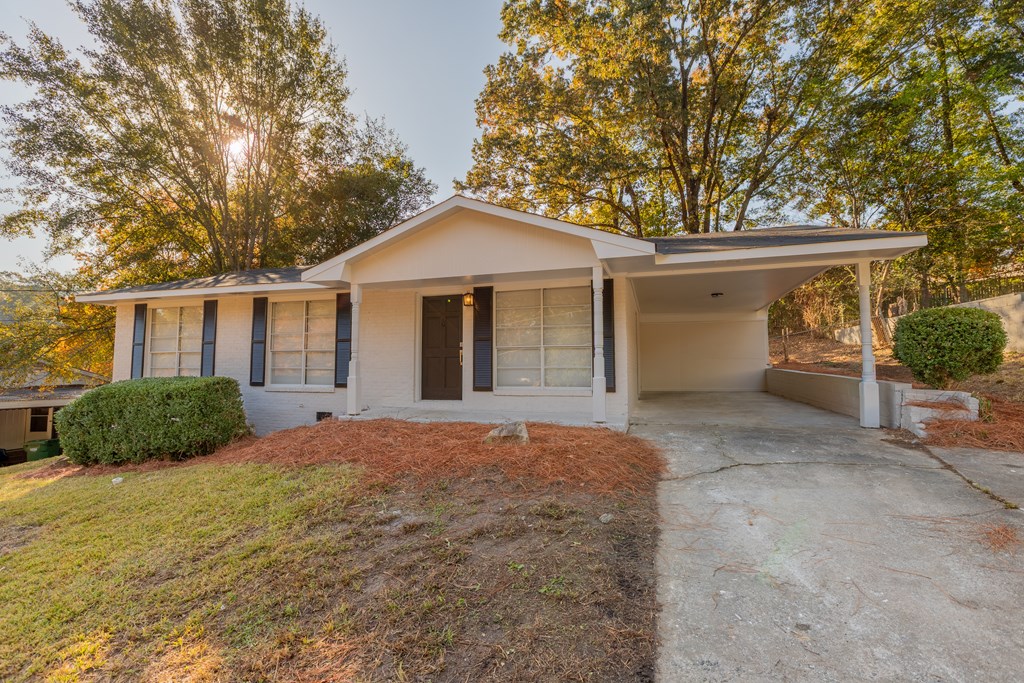 4813 Rowland Court Columbus, GA 31907 - Photo 2 of 16 a front view of a house with a yard and garage