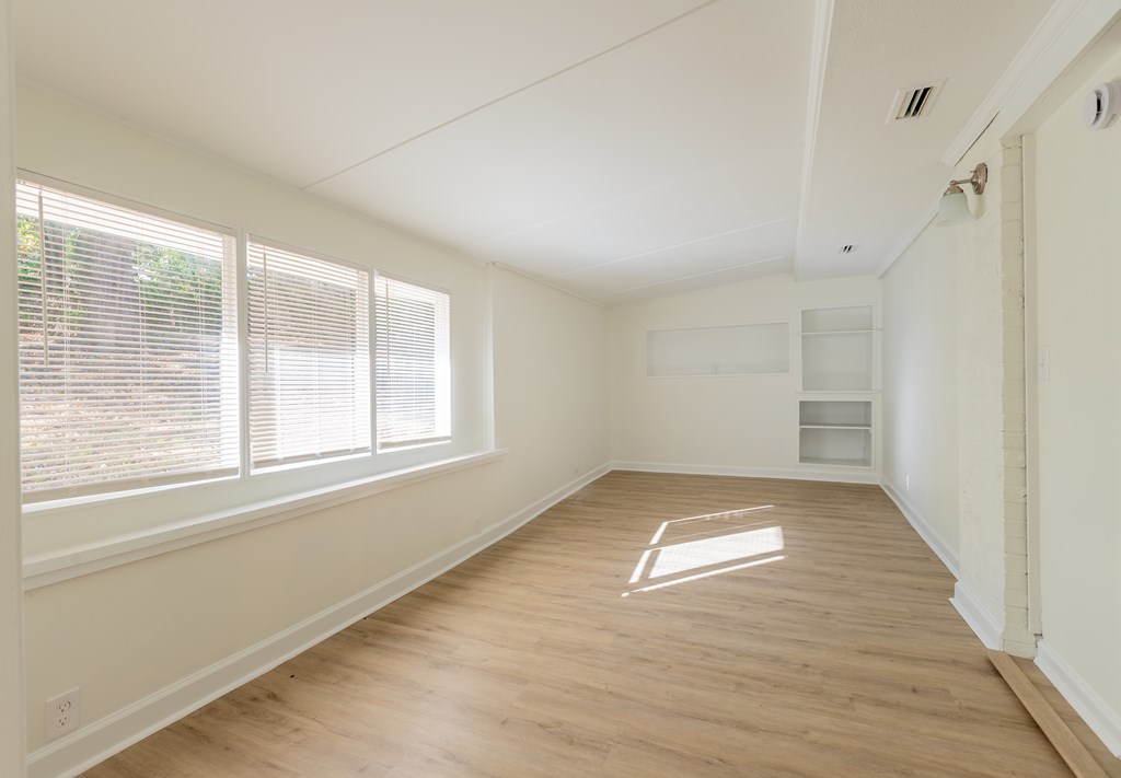 4813 Rowland Court Columbus, GA 31907 - Photo 5 of 16 a view of empty room with wooden floor and fan