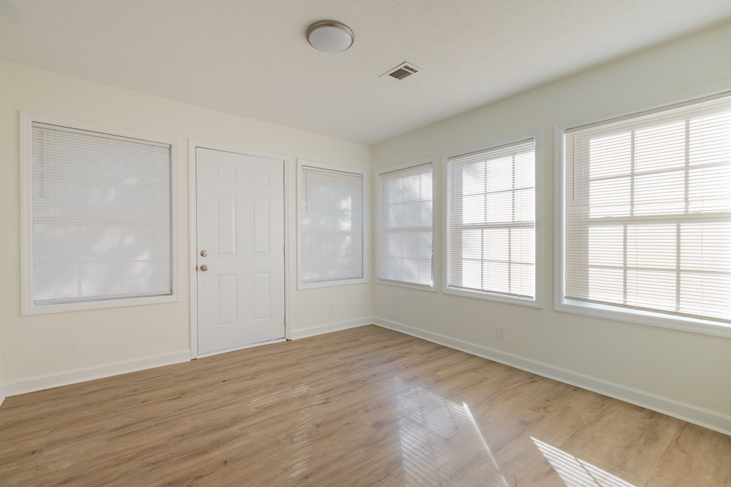 4813 Rowland Court Columbus, GA 31907 - Photo 6 of 16 an empty room with wooden floor and windows