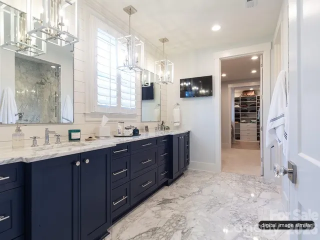 a bathroom with a sink vanity and mirror