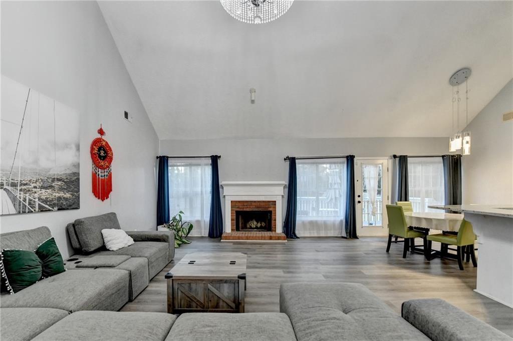 235 Ruby Forest Parkway Suwanee, GA 30024 - Photo 12 of 59 a living room with furniture and a fireplace