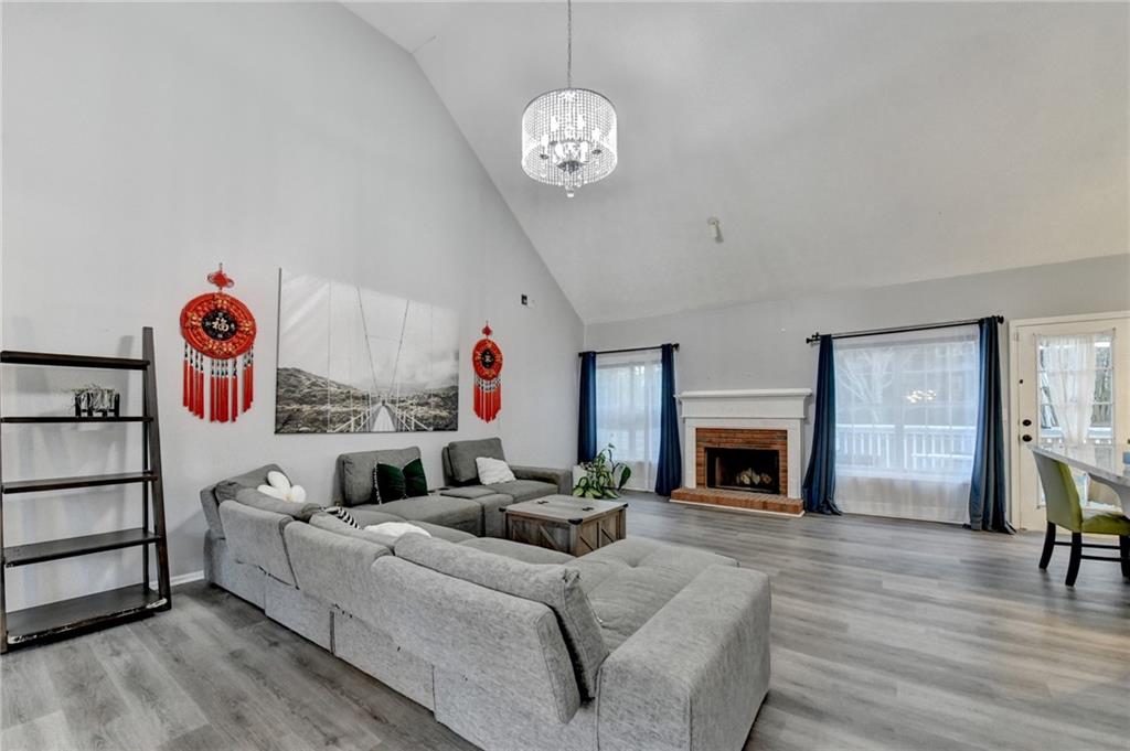 235 Ruby Forest Parkway Suwanee, GA 30024 - Photo 13 of 59 a living room with furniture and a fireplace