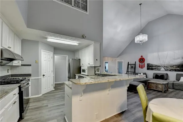 a kitchen with a sink cabinets and stainless steel appliances