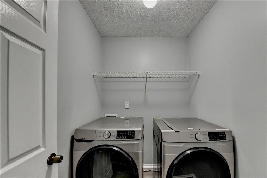 235 Ruby Forest Parkway Suwanee, GA 30024 - Photo 39 of 59 a utility room with dryer and washer