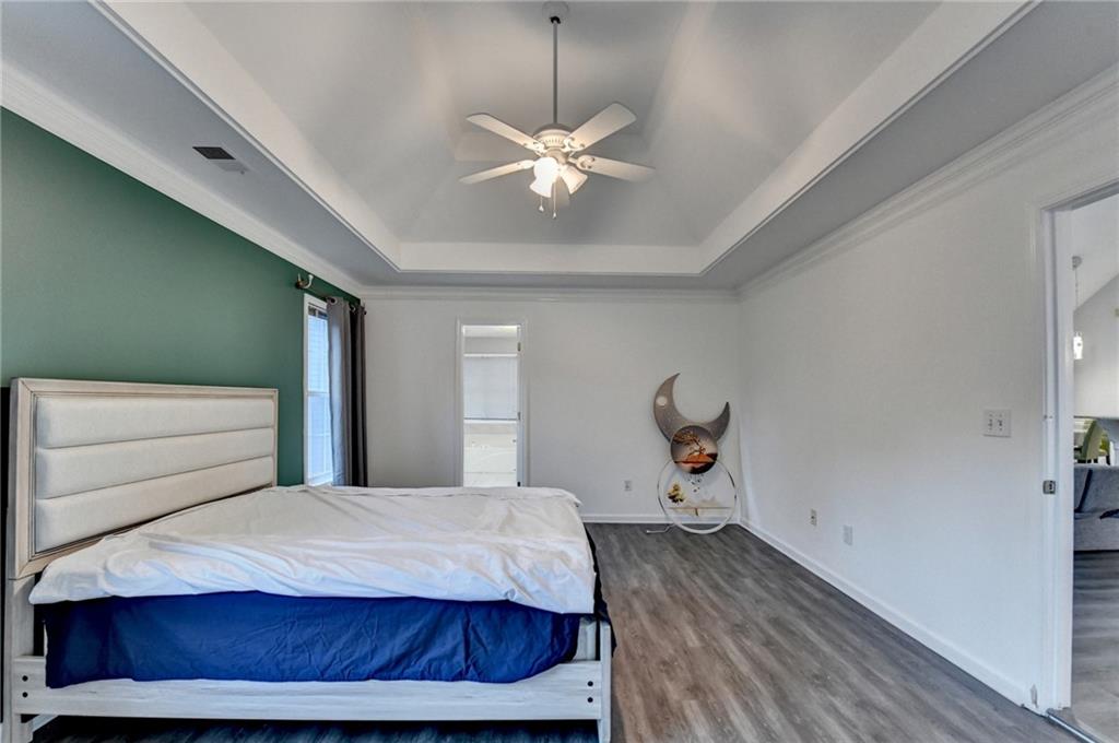 235 Ruby Forest Parkway Suwanee, GA 30024 - Photo 41 of 59 a bedroom with a bed and window