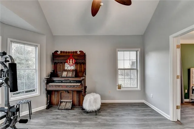 a bedroom with a bed and gym equipment