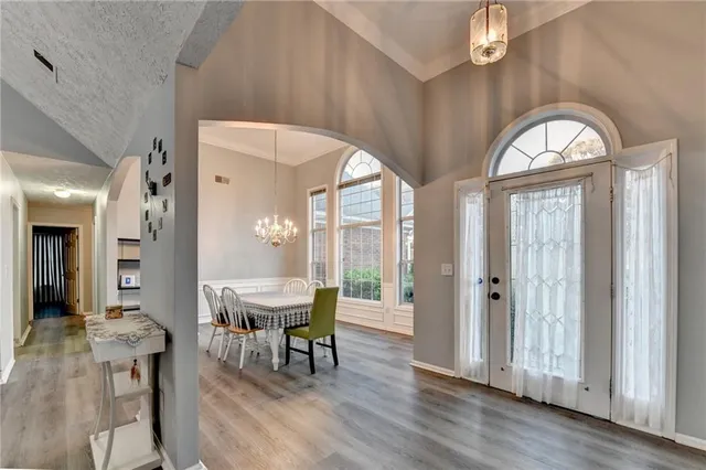 a view of a dining room with furniture window and wooden floor