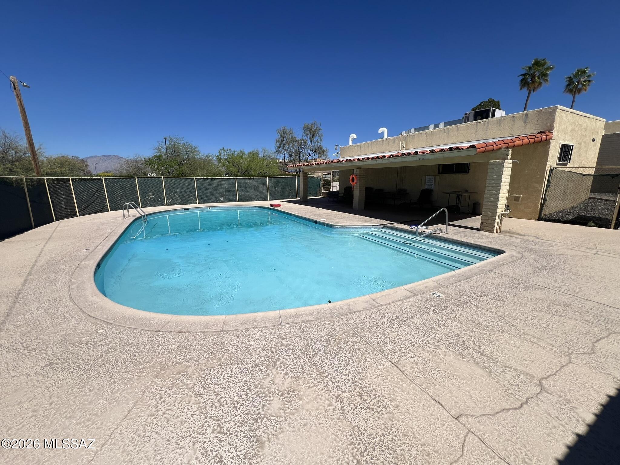 810 South Kolb Road, Unit 53 Tucson, AZ 85710 - Photo 7 of 7 a view of a swimming pool with a yard