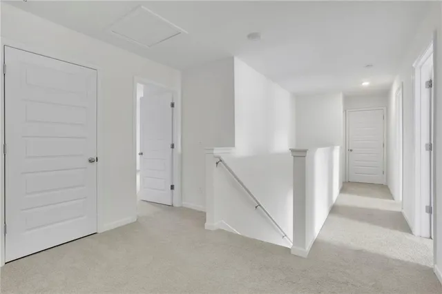 a view of an empty room with a hallway