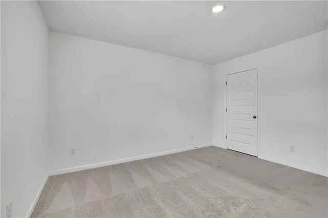 a bathroom with a granite countertop sink a toilet and a bathtub