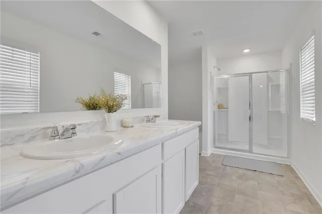 a bathroom with a bathtub and a window