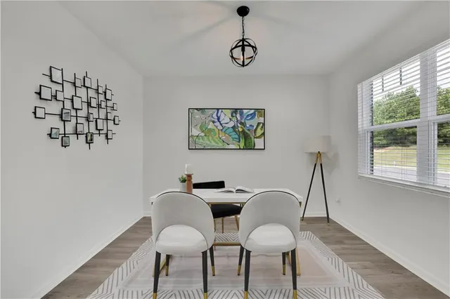 a view of a dining room with furniture window and outside view