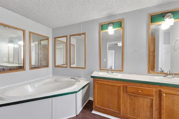a bathroom with a sink and a large mirror