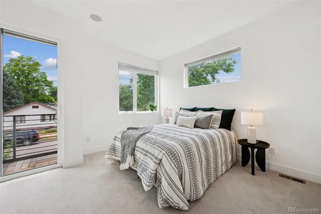 a bedroom with bed and a window