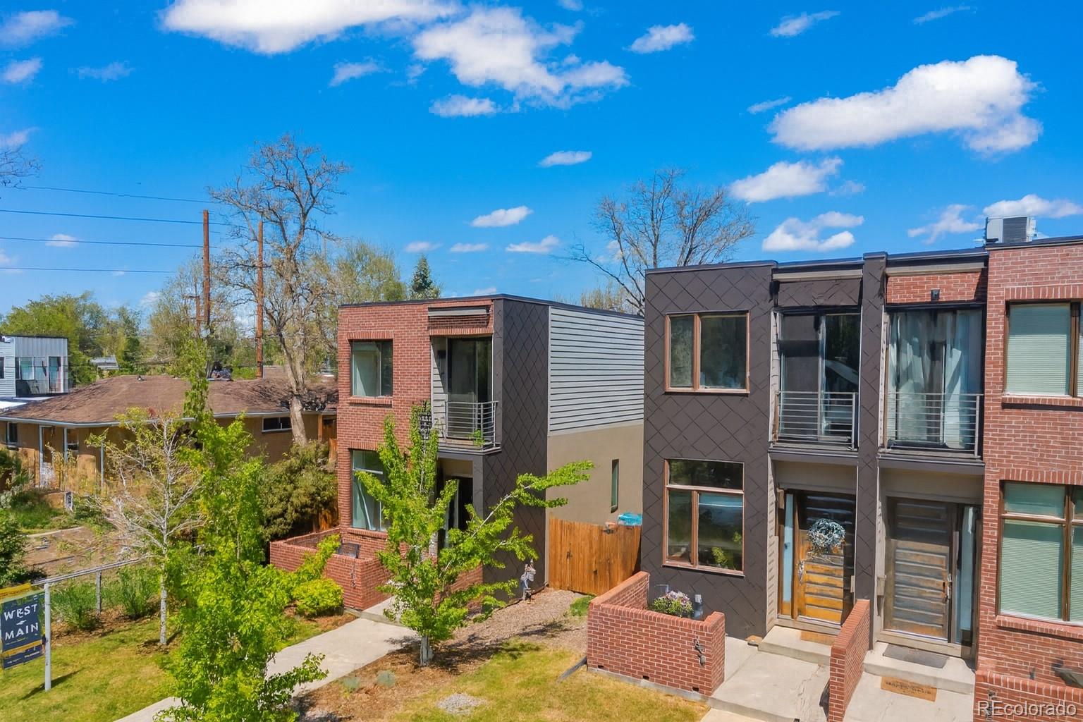 1833 East Jewell Avenue Denver, CO 80210 - Photo 2 of 41 a front view of a house with a yard
