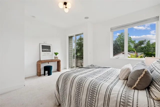 a bedroom with a bed and a fireplace