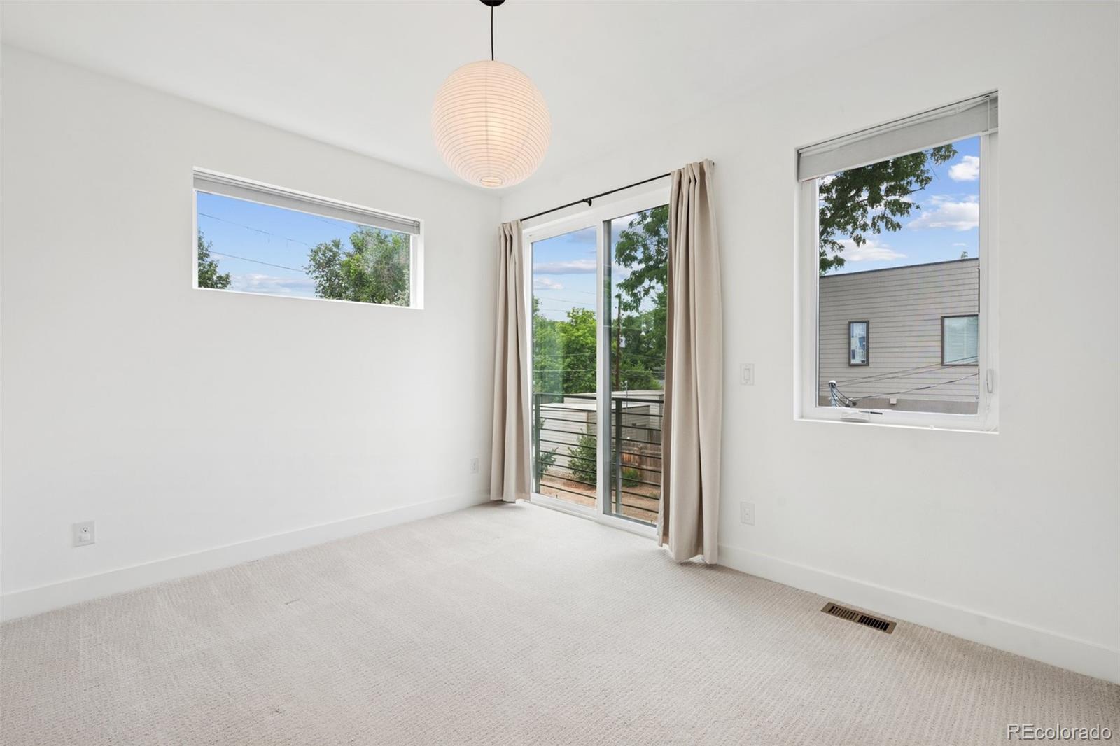1833 East Jewell Avenue Denver, CO 80210 - Photo 27 of 41 a view of an empty room with a window