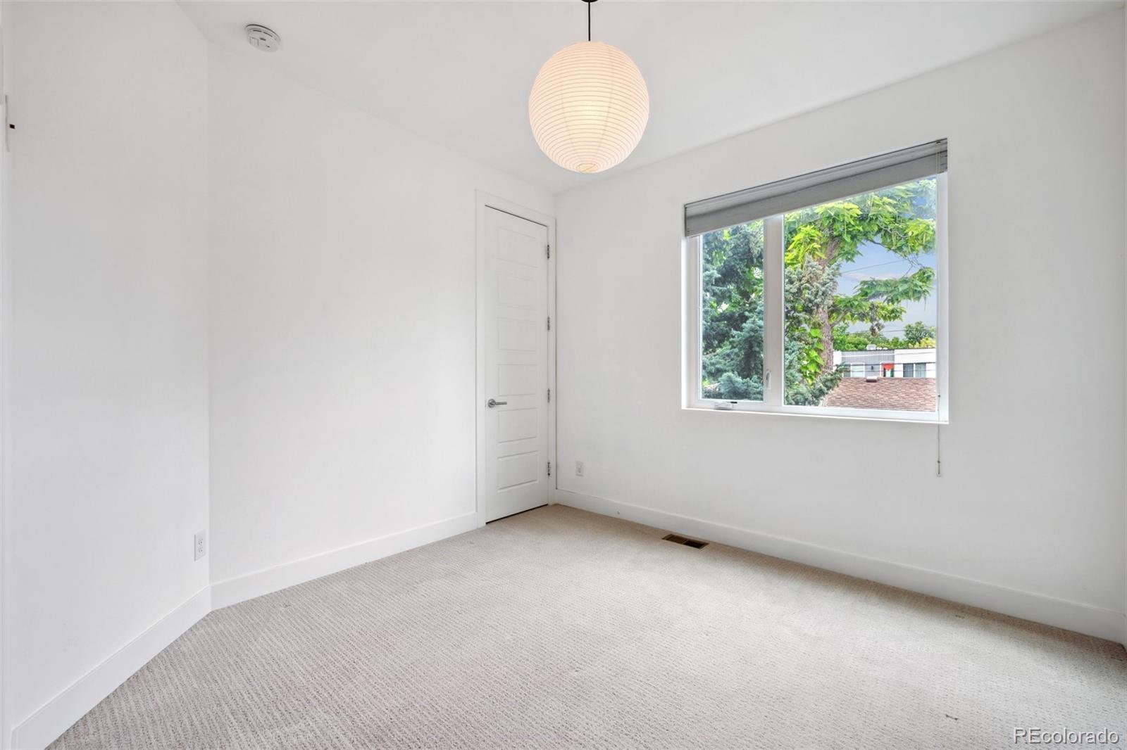 1833 East Jewell Avenue Denver, CO 80210 - Photo 29 of 41 an empty room with windows